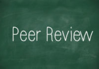 Peer Review written in white chalk
