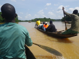 Researchers travelling down the Djerem River in central Cameroon to reach a field site deep in Mbam et Djerem National Park.