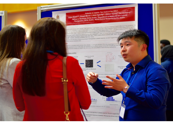 Louis Richter, a medical student from RCSI, presents his research entitled “Patients on aspirin: Too little or too much?” to a committee of judges during a poster session at ICHAMS 2016.
