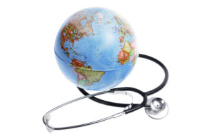 World Globe and Stethoscope on White Background