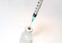 Needle syringe with a vaccine bottle. Credit NIH