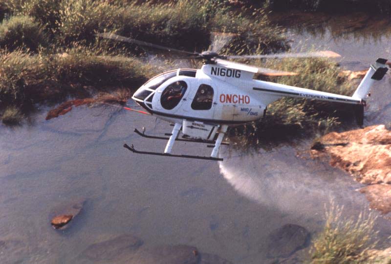 Helicopter spraying larvicides on breeding sites of the blackfly in West Africa