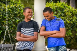 Two young men laughing