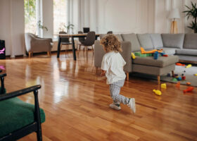 Child playing in living room at home