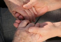 Young and old hands clasping