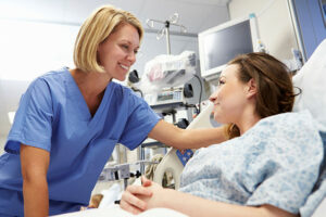Young patient talking to nurse in A&E
