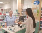 A customer presenting a discreet Lifeguard ‘cue card’ to the pharmacist