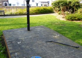 Image shows John Snow memorial, water pump with handle removed.
